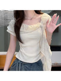 Pure-Style Design with a Waist-Constricting Fit That Slimlines The Figure. Ruffle-Trimmed, Tie-Cuffed Design. Sweet, Plaid Patterned Short-Sleeved Top for Summer, with a Shoulder-Bare Design