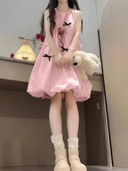 Charming Pink Sleeveless Bubble Skirt Dress with a Cute Black Bow Decoration, Featuring a Relaxed Fit That Gives a Youthful Appearance